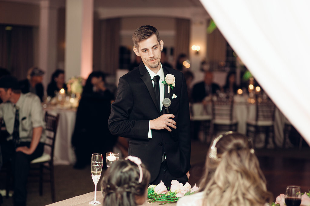 Wedding Photograph Of Groom Speaking To a Woman While Standing Los Angeles