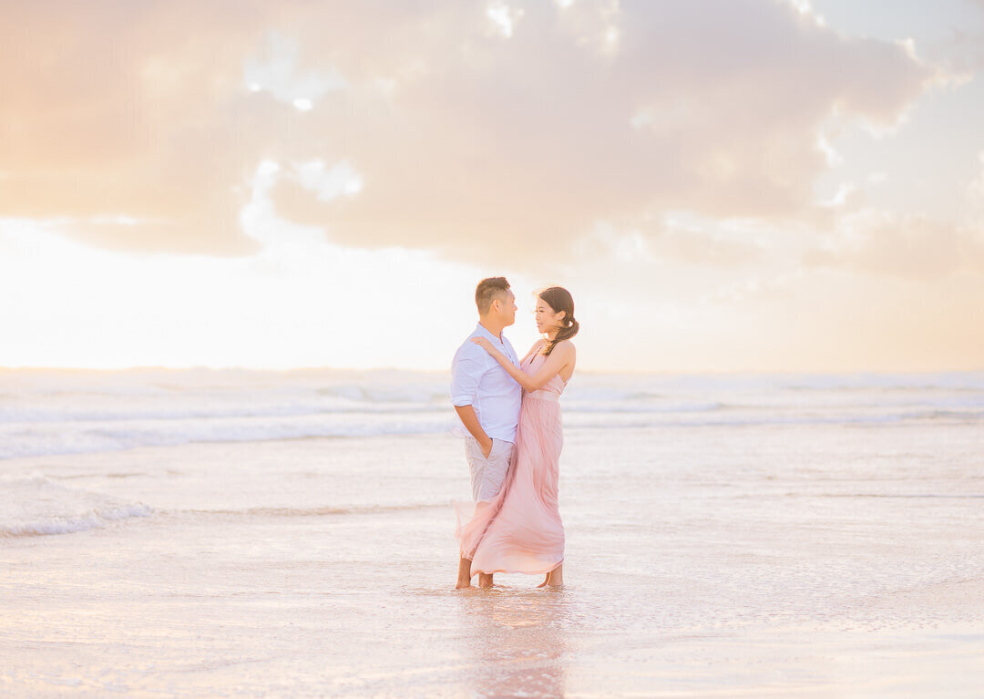 couple on the spit main beach gold coast sunrise golden hour portrait engagement session