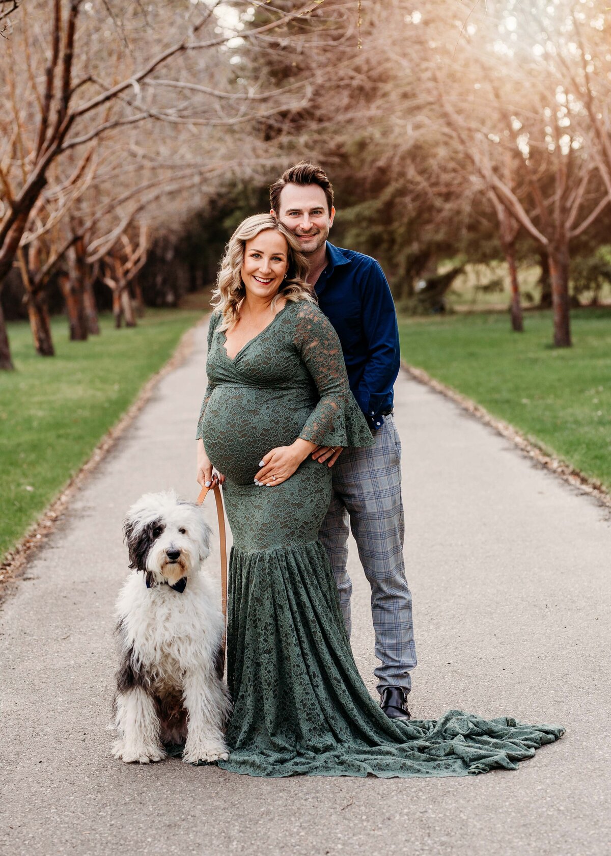 Parents to be posing with Dog