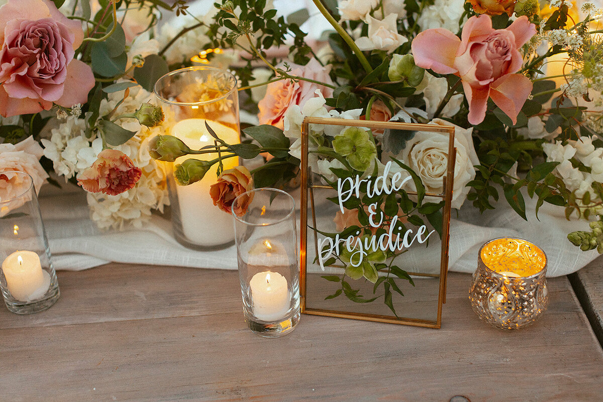 glass framed table number with calligraphy