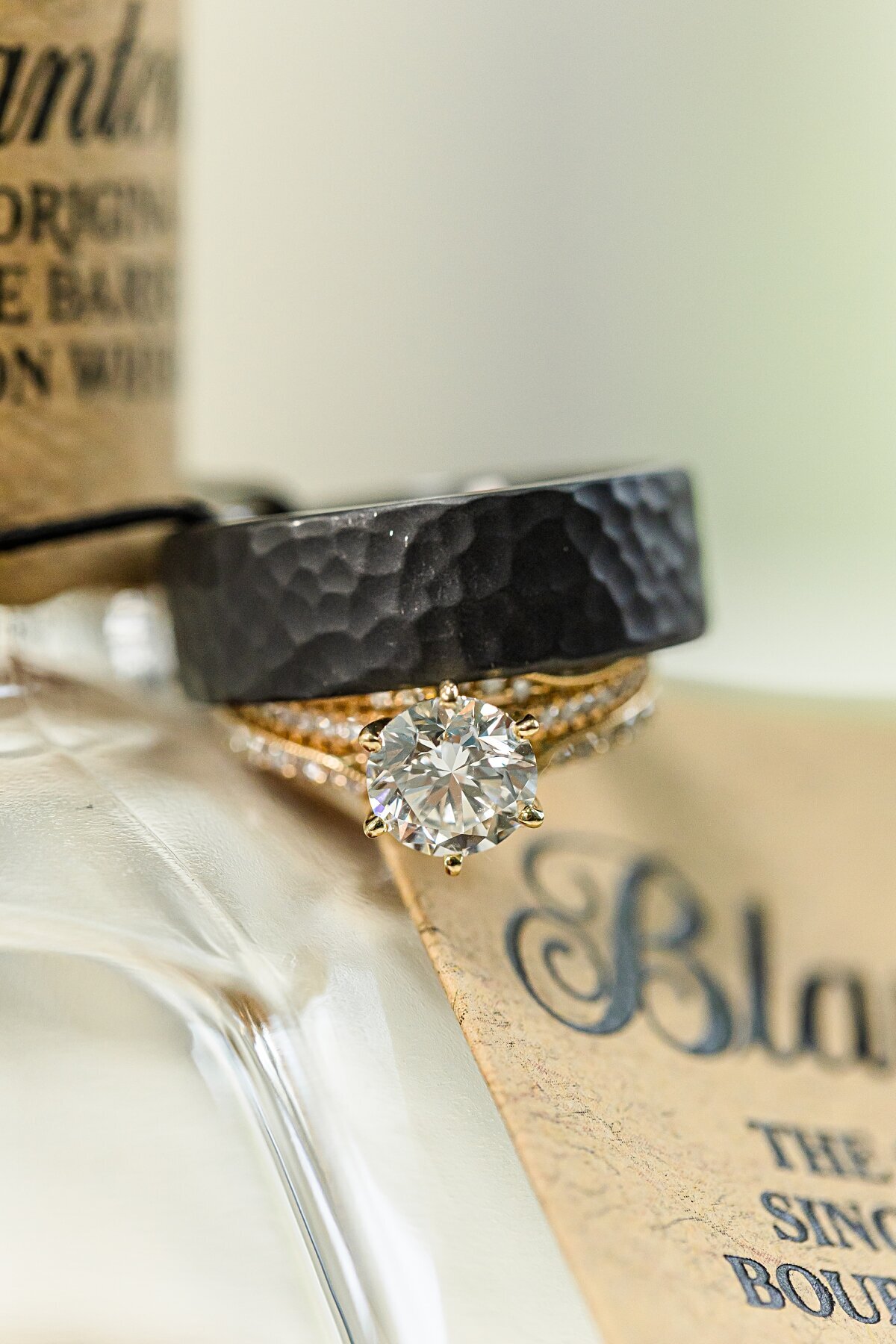 wedding-rings-hanging-off-Blatons-bourbon-whiskey