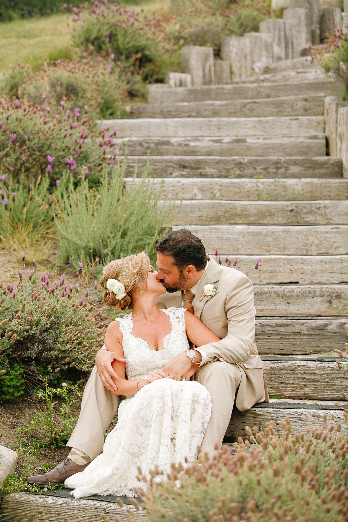 A bride and groom share a kiss at the Carmel Valley Ranch wedding.