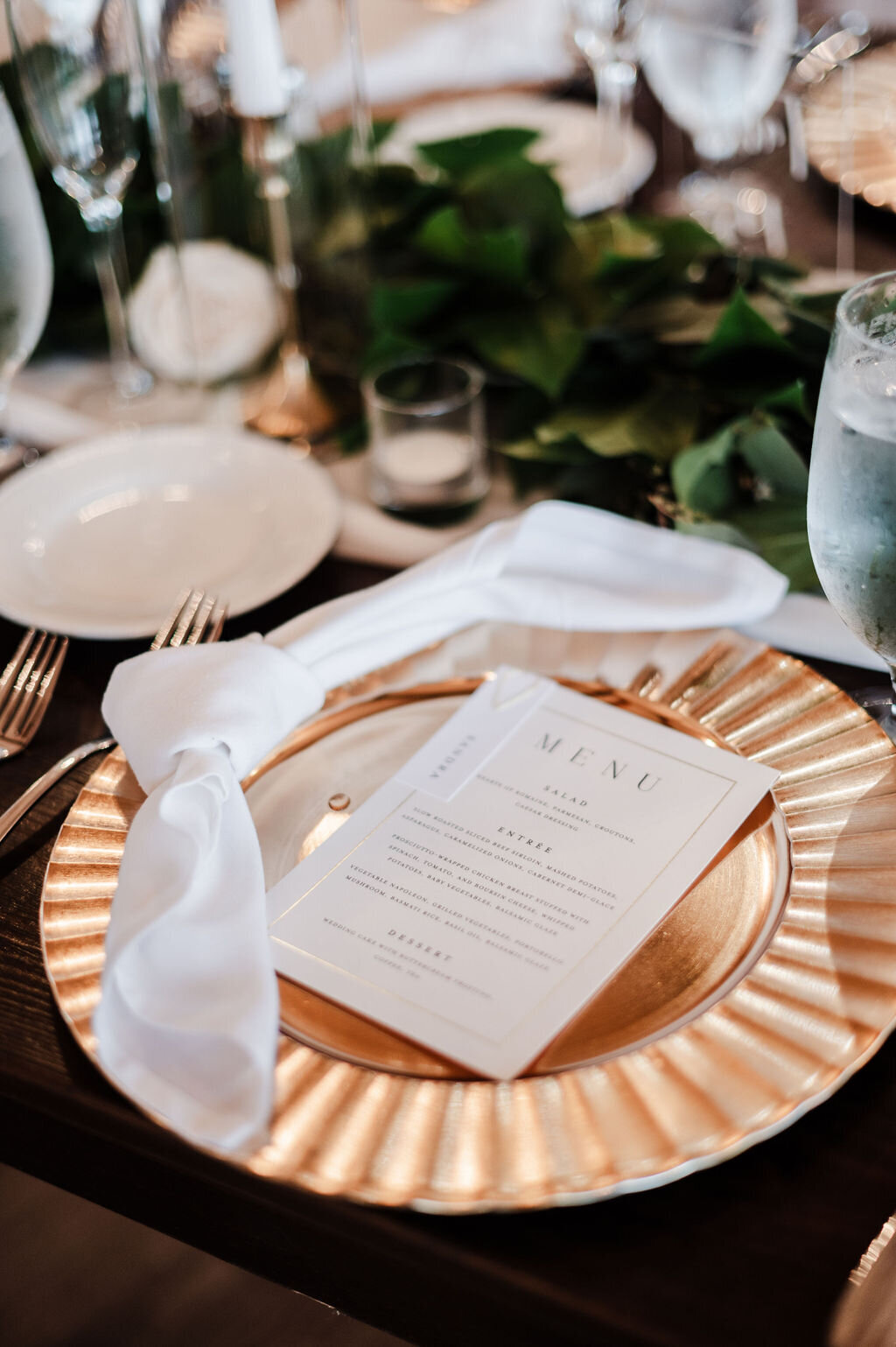 Gold charger with napkin tie and menu place card