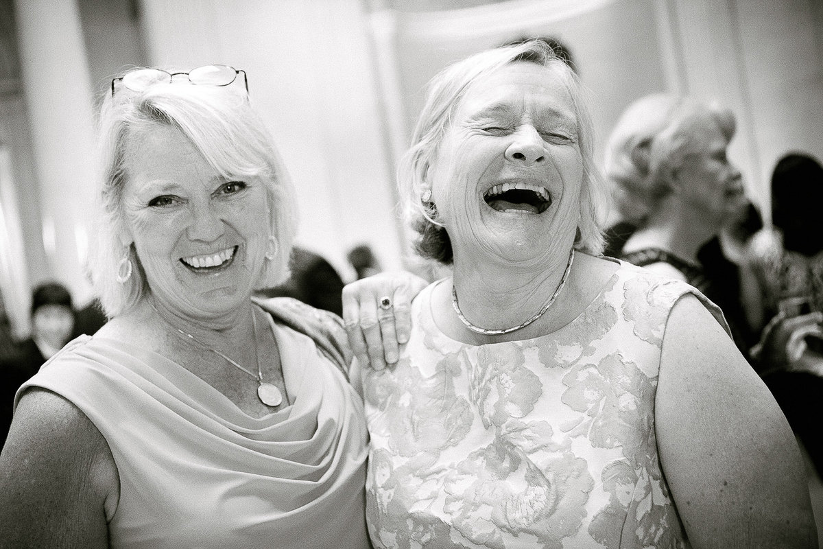 Mother of the bride laughing.