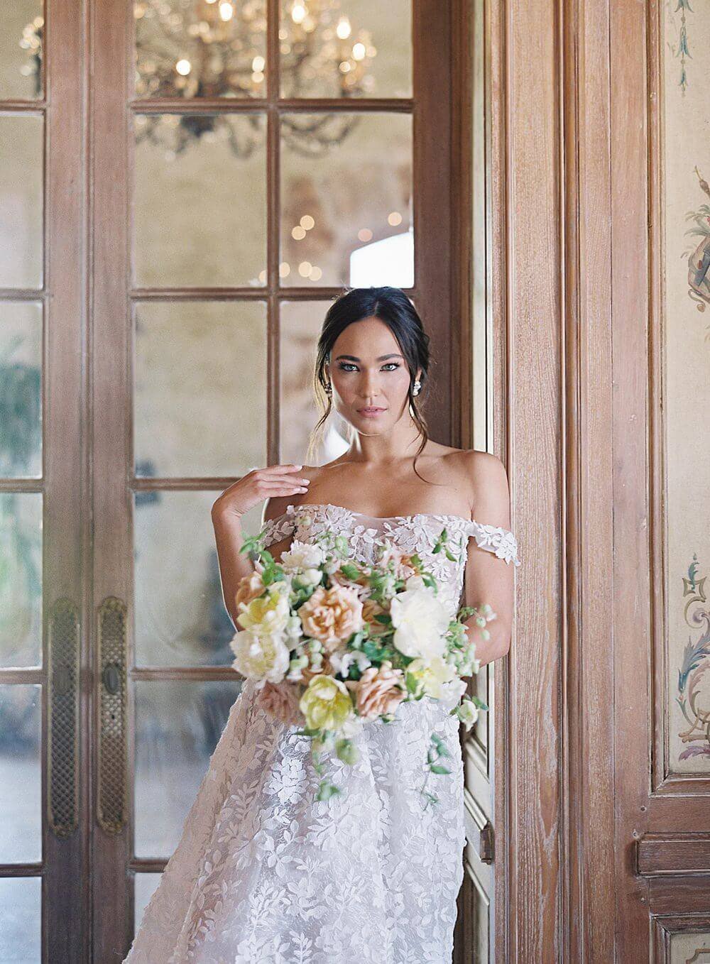 Bride with florals inside cal-a-vie on wedding day  | Jacqueline Benét