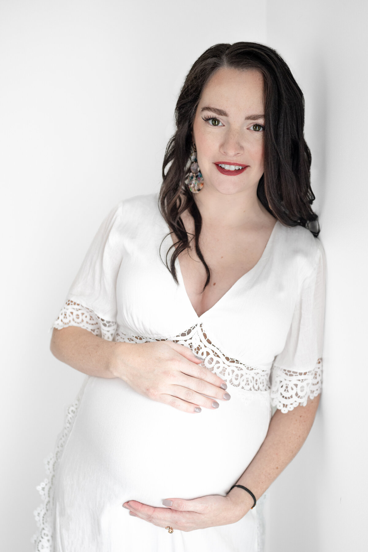 A maternity picture of a mother cradling her stomach