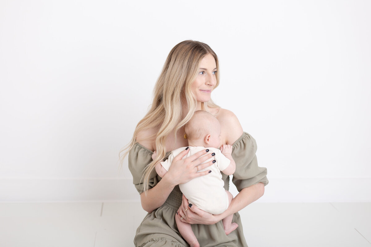 A photo of mom holding her baby in Salt Lake City studio