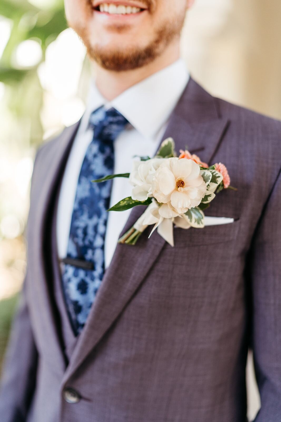 boutonnieres for a bold addition to the groom and groomsmen's suits.