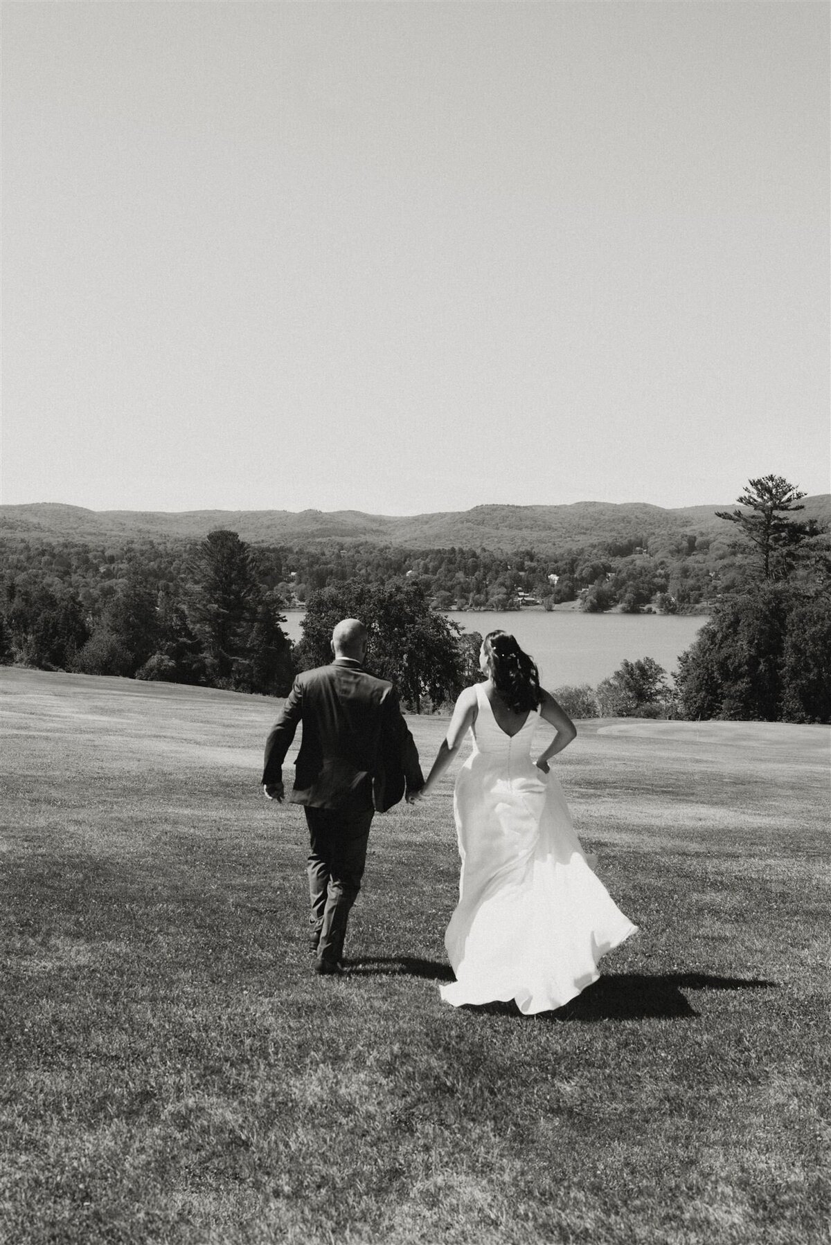 couple running during new york wedding photos