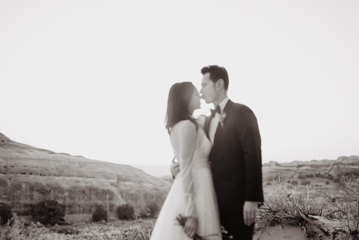 Utah elopement photographer captures couple kissing in black and white portraits