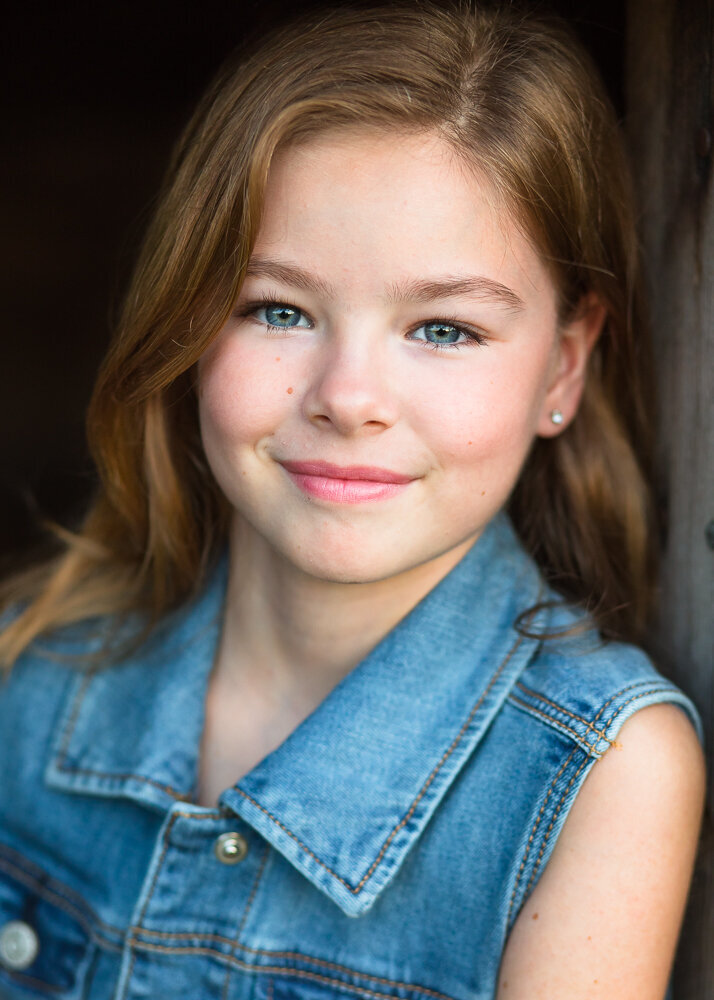 Outdoor actors headshot of a young child actor in Raleigh, NC
