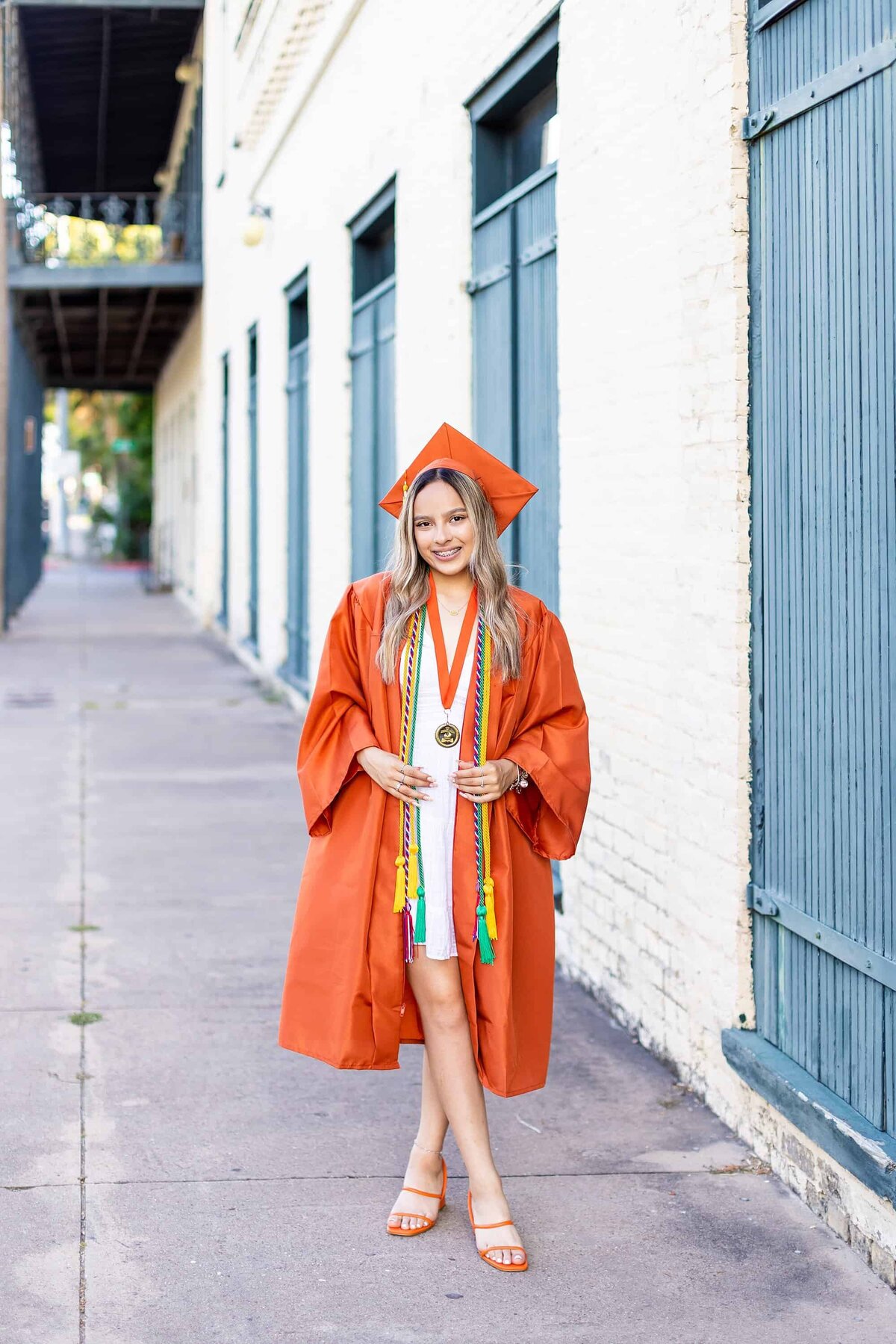 Senior orange cap and gown