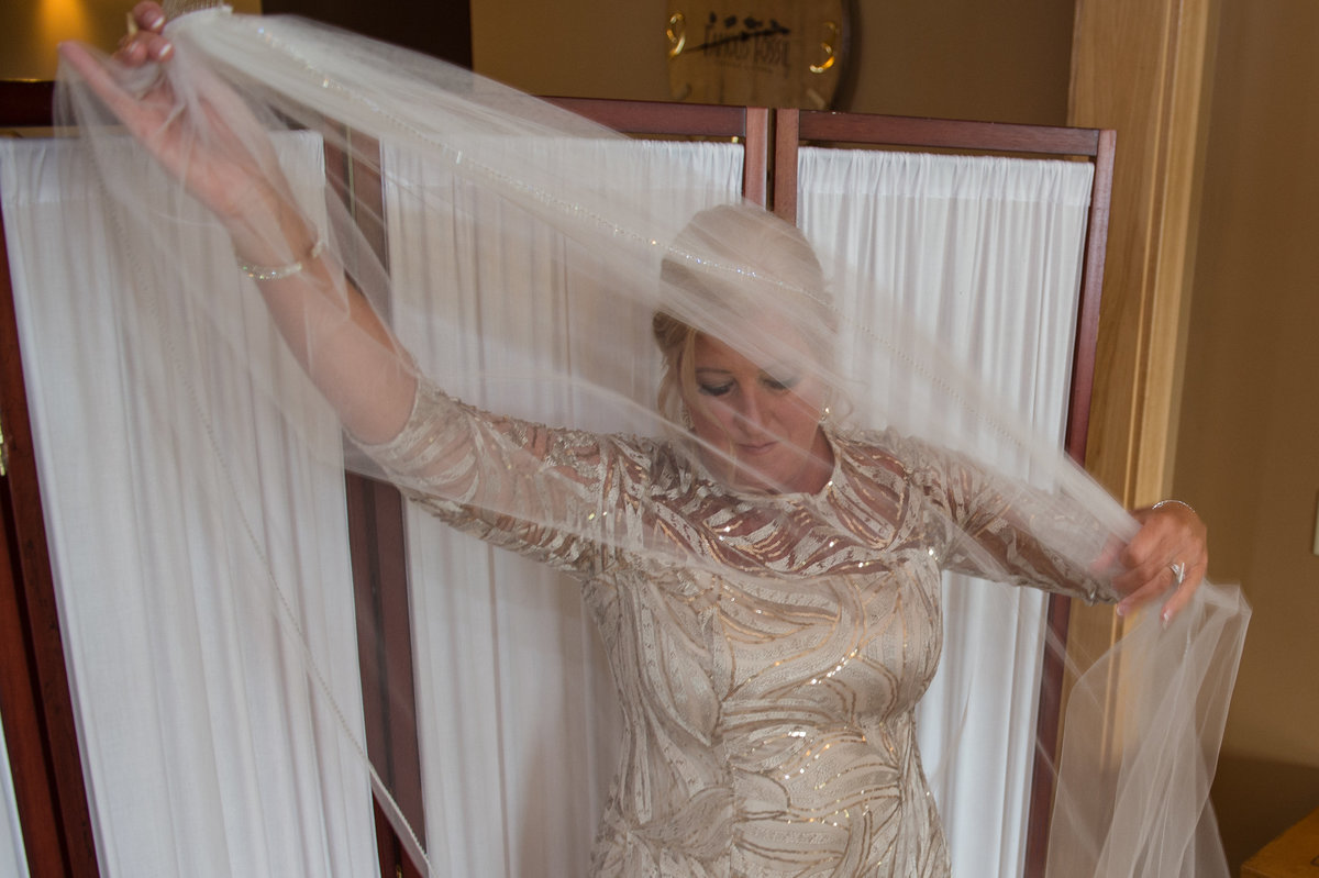 mother of bride spreads veil