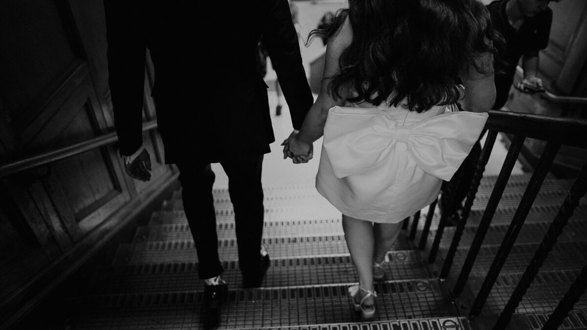A bride and groom take the London Underground to their wedding ceremony. 
