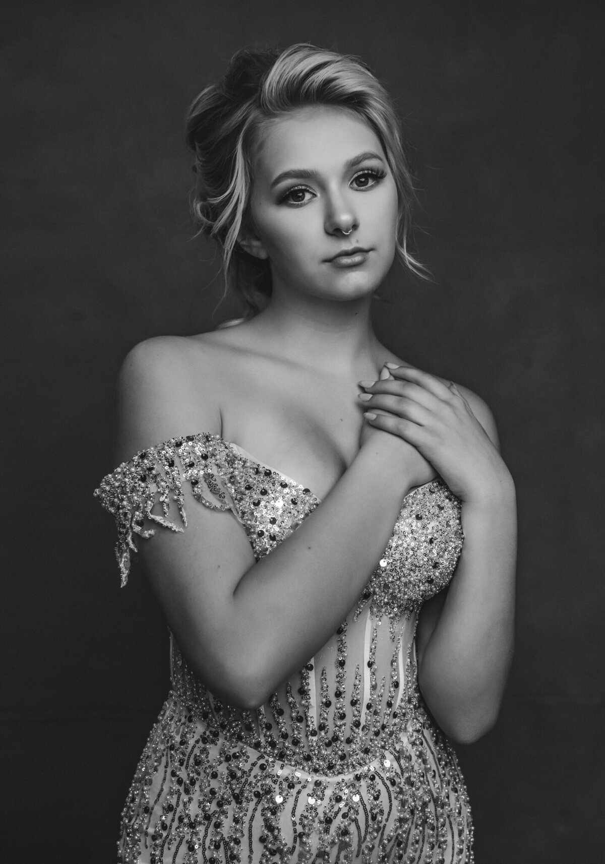 Elegant high school senior portrait session featuring studio lighting and timeless styling