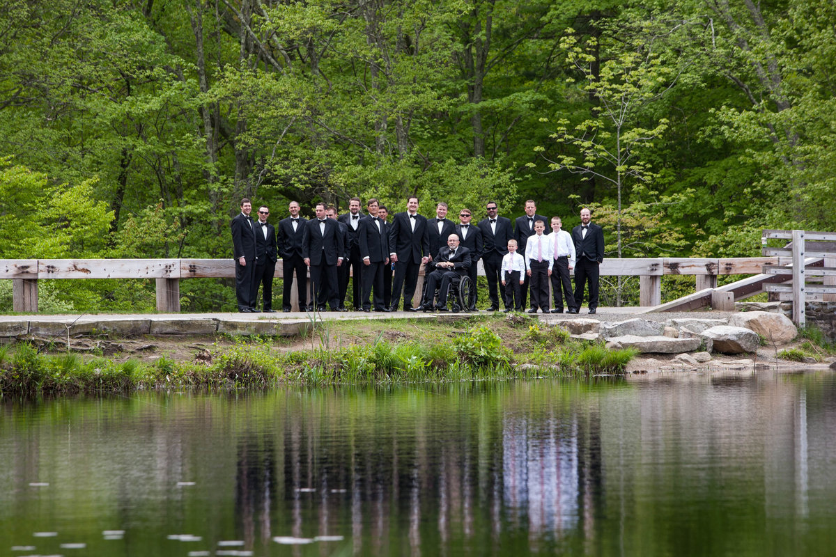 groomsmen at lake edge