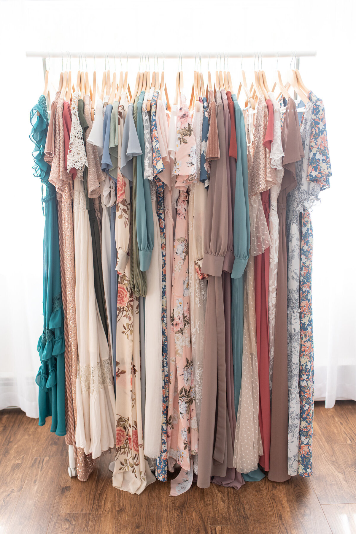 A picture of a rack of dresses from the Client Closet of Sharon Leger Photography.