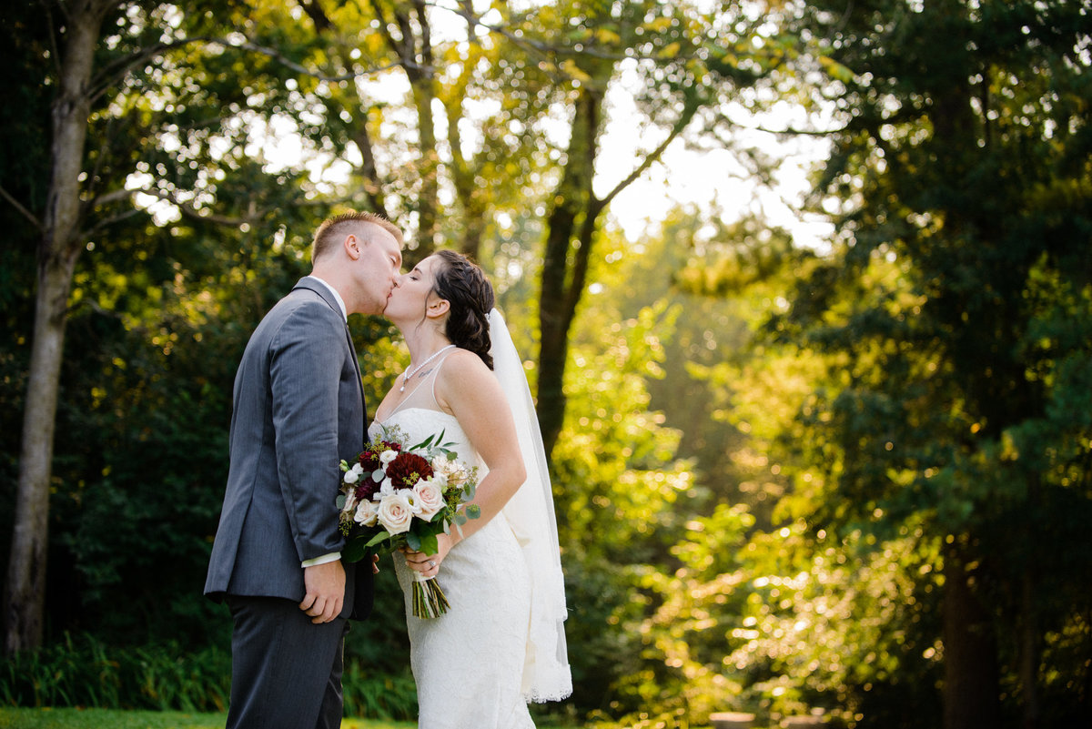 Bride and Groom kissing at The Hilltop in Spring Green