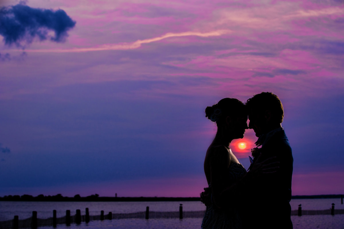 couple at sunset at the new jersey shore at portrait session