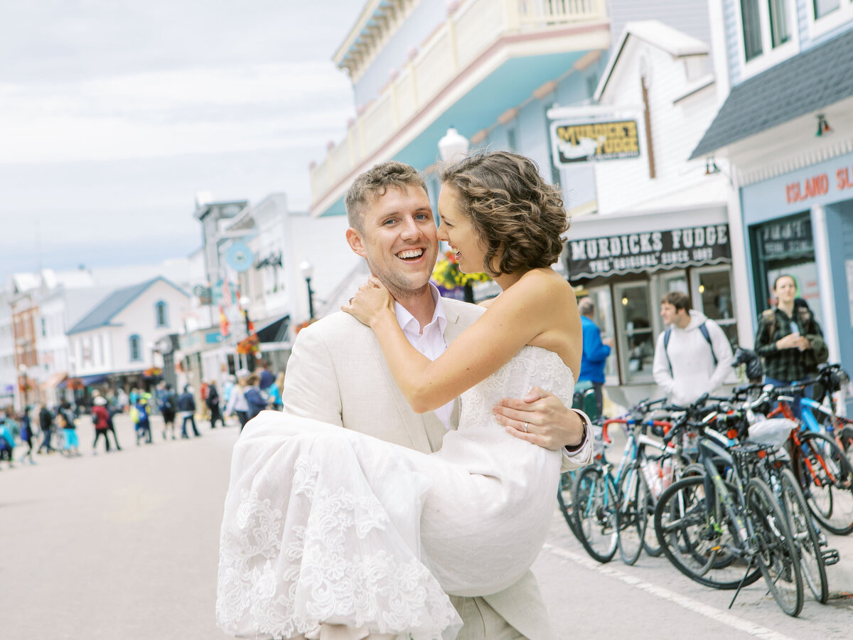 Bride and Groom walking down Main Street Mackinac