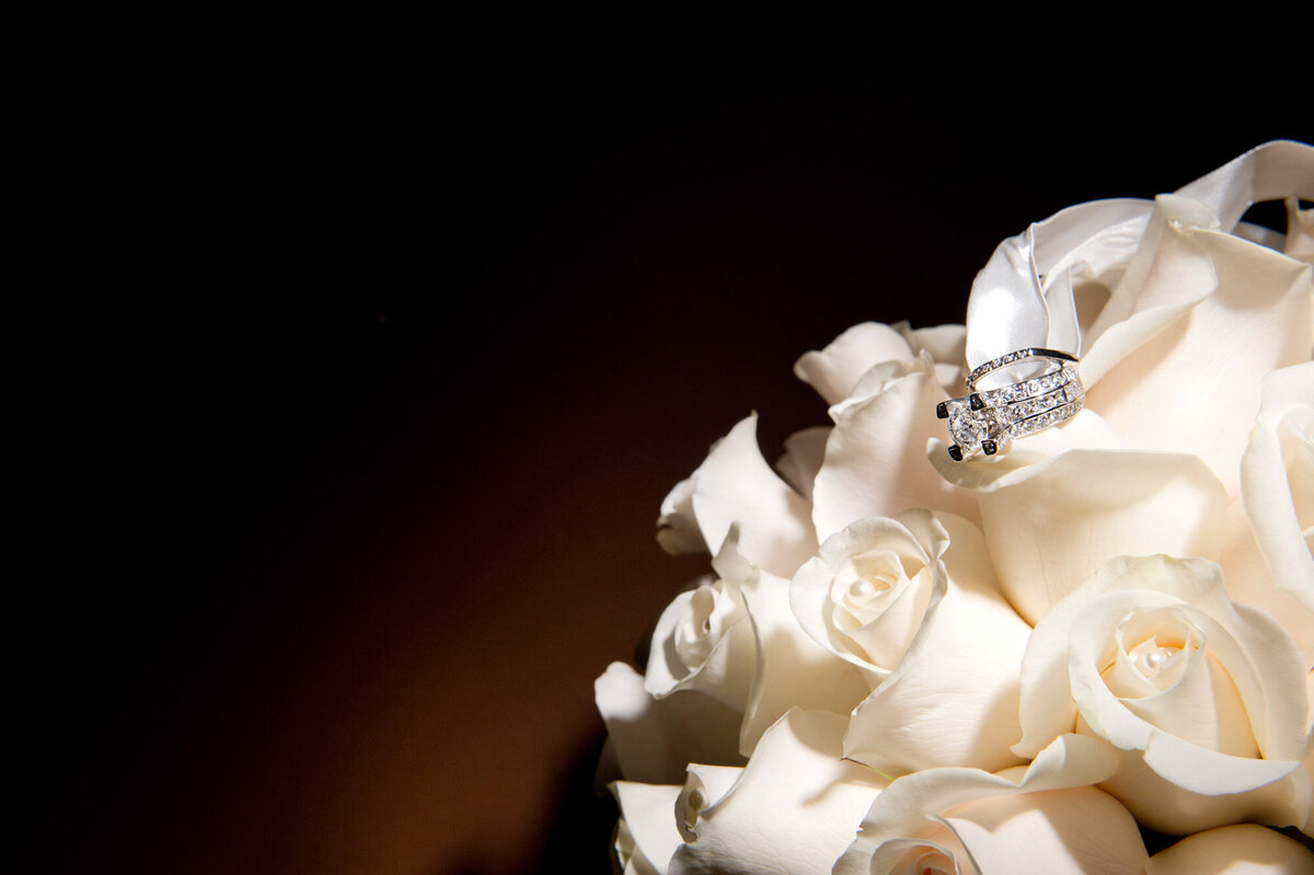 Elegant white floral bouquet with the ring on top