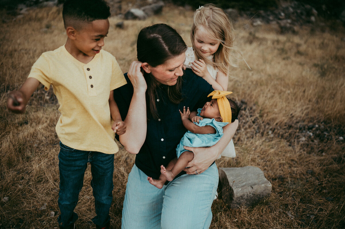 baby and mom photographed by portland newborn photographer evelynne gomes greenberg