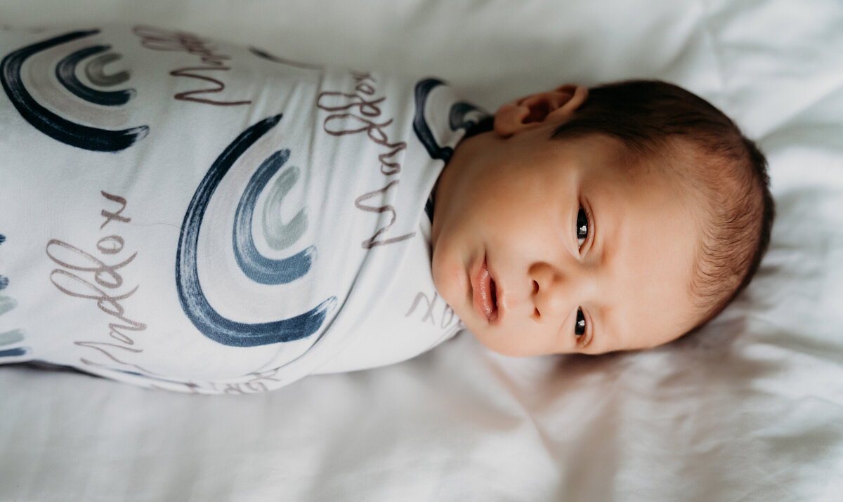Newborn Photography, Baby boy looking at the camera.