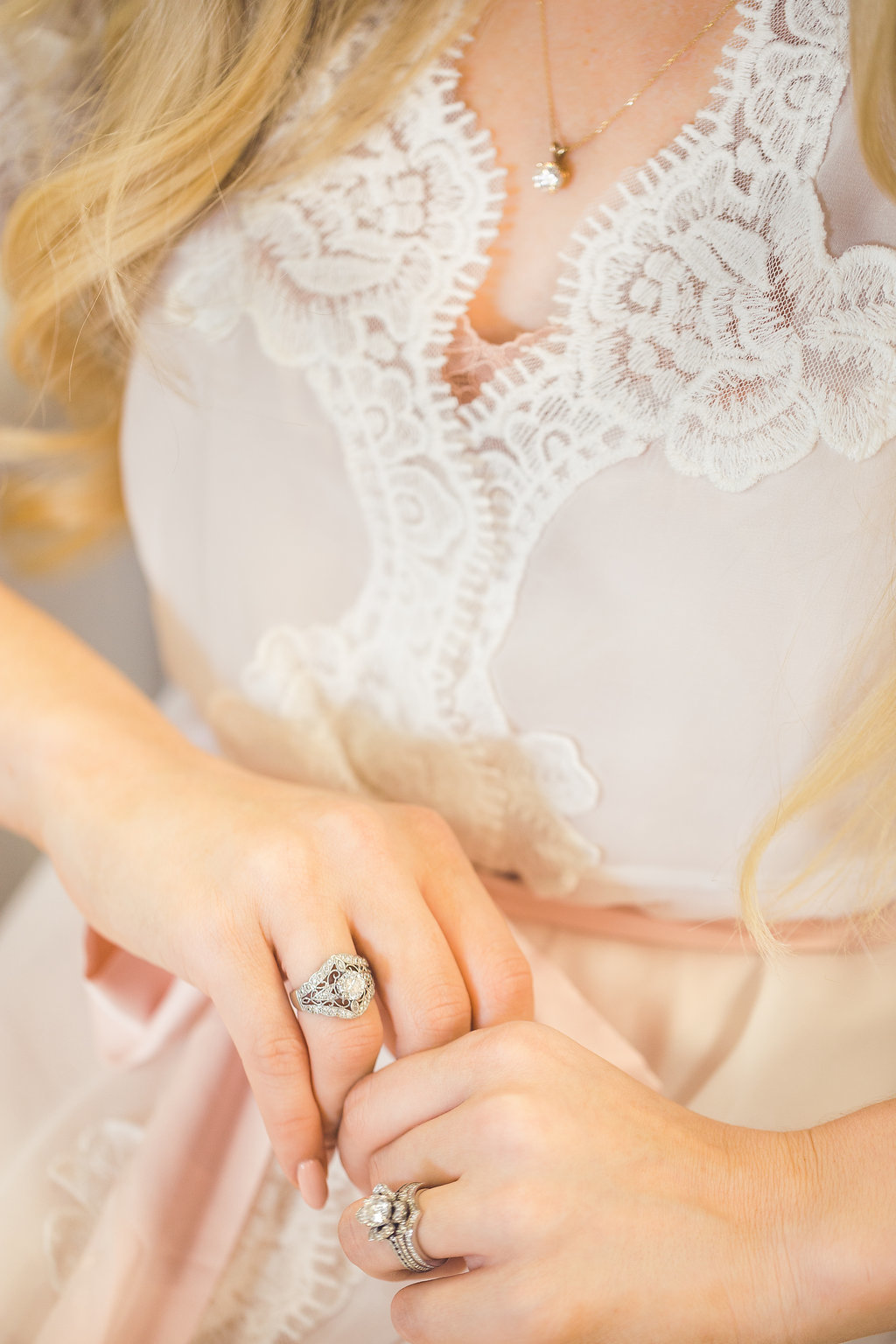 Wedding Photograph Of  Woman  in Peach Dress Holding a Ring Los Angeles