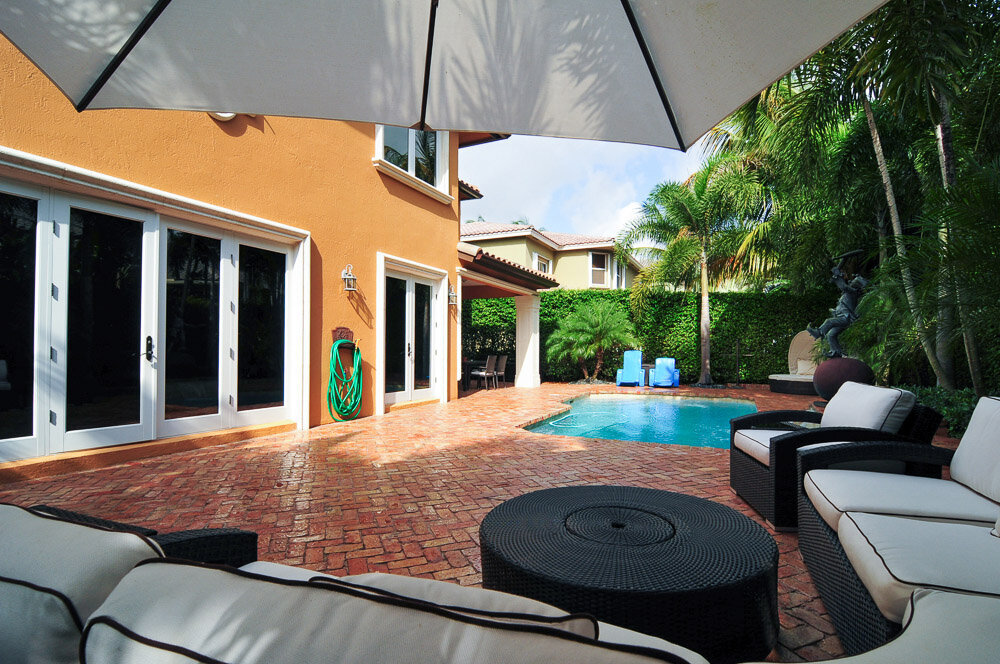 with pool, furnished and surrounded by palm trees
