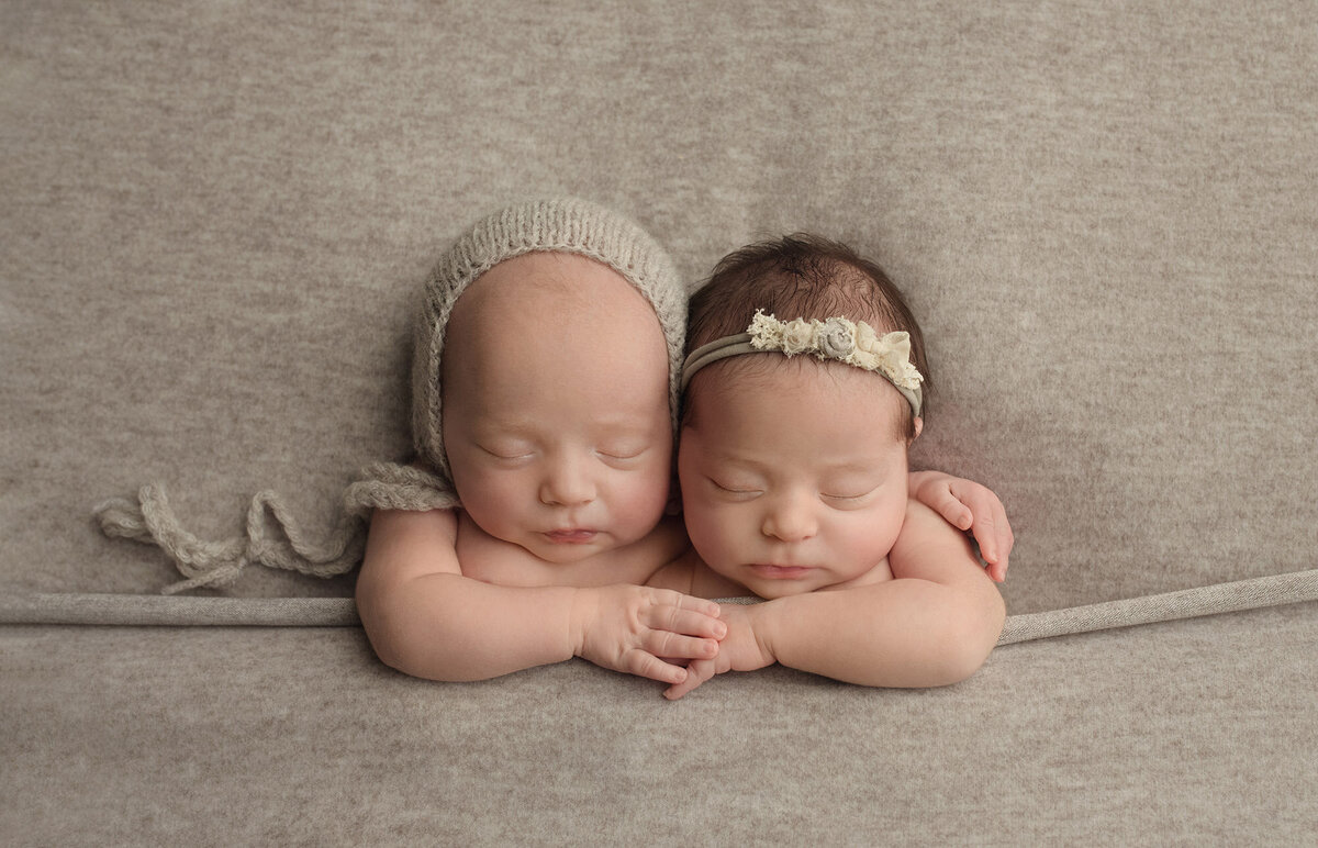 Boy girl twins photographed in embrace