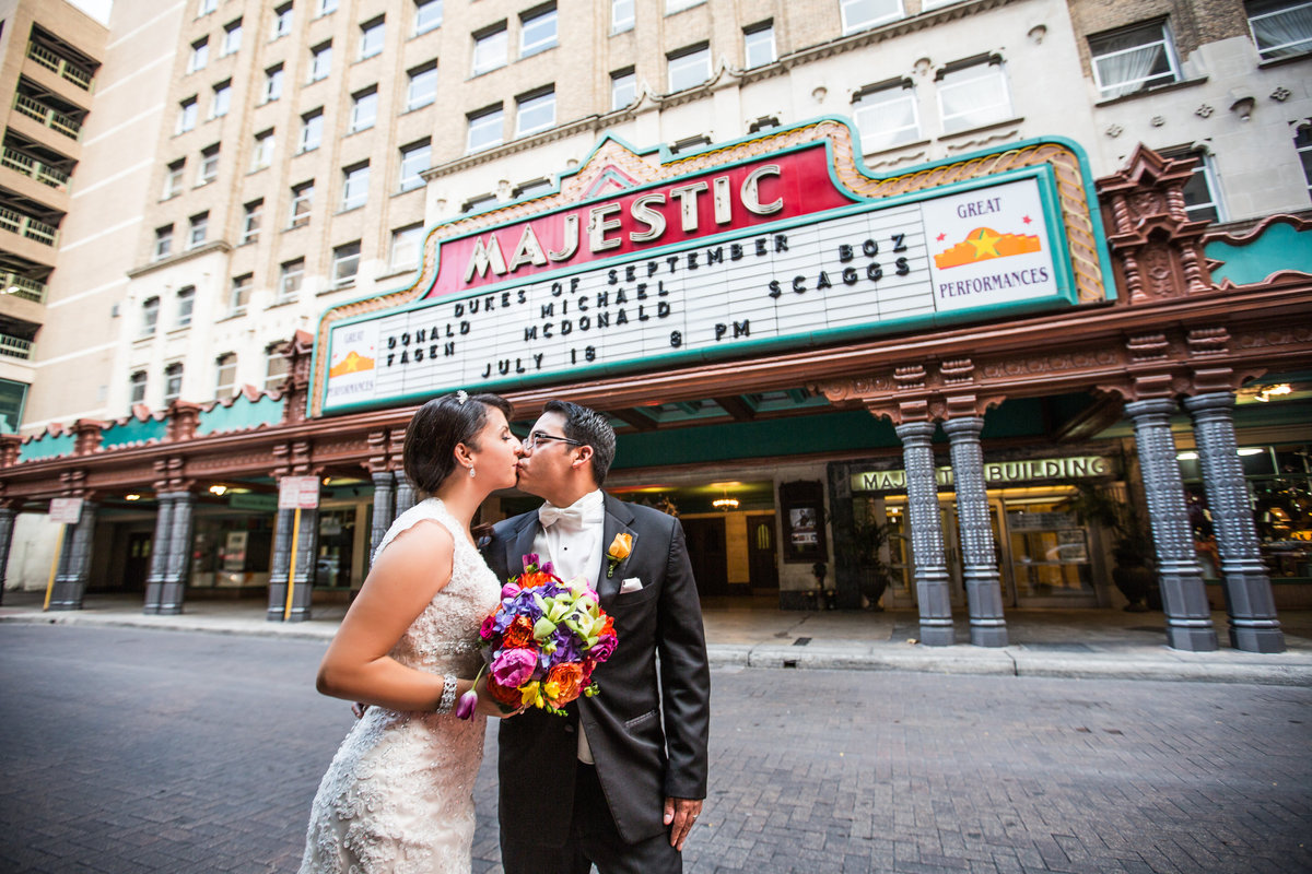 bride and groom in front of Majestic Theater on 224 E Houston St. in downtown San Antonio after getting married