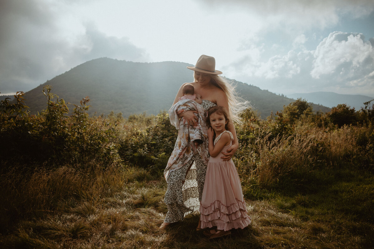 mom with daughters in blue ridge mountains