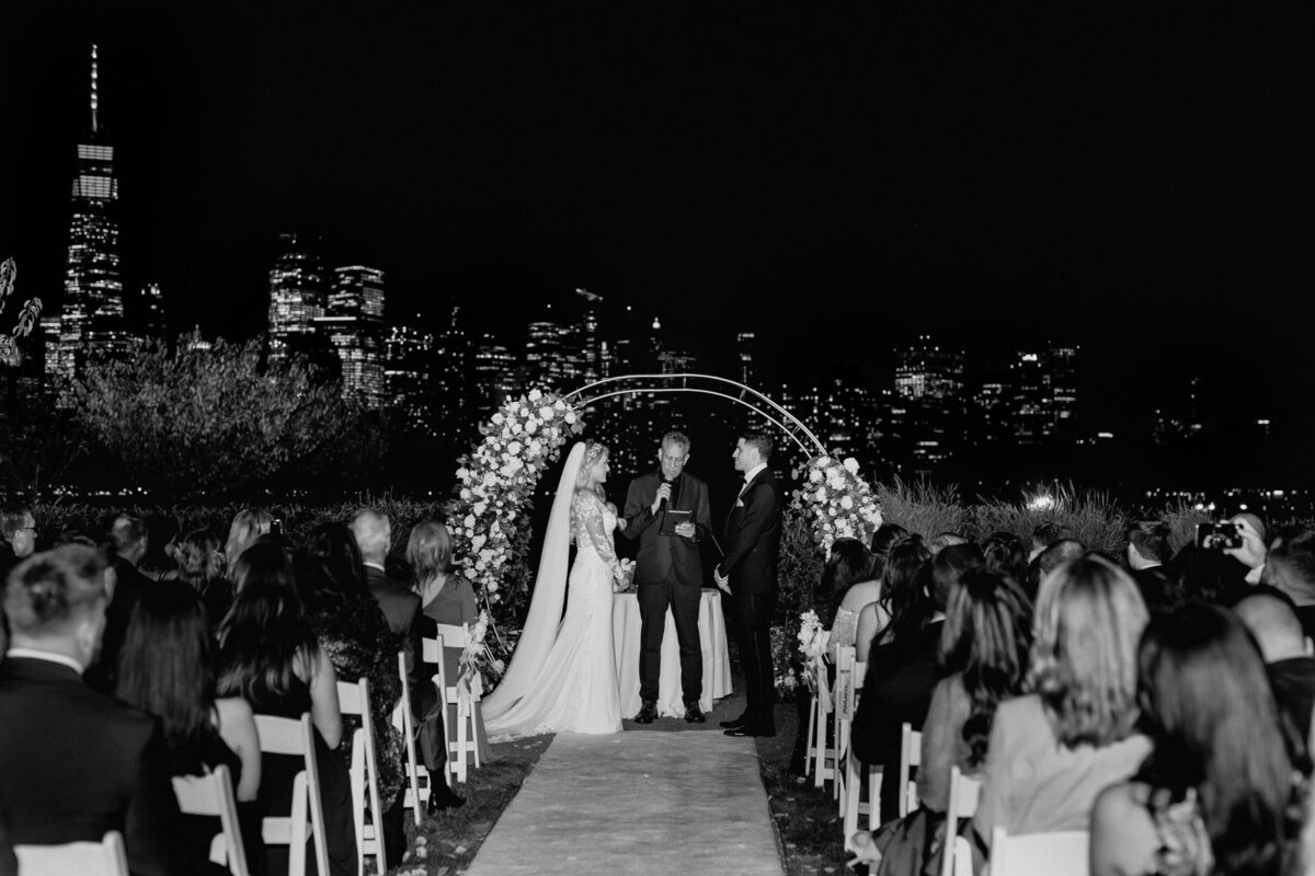 Photo of couple getting married after dark