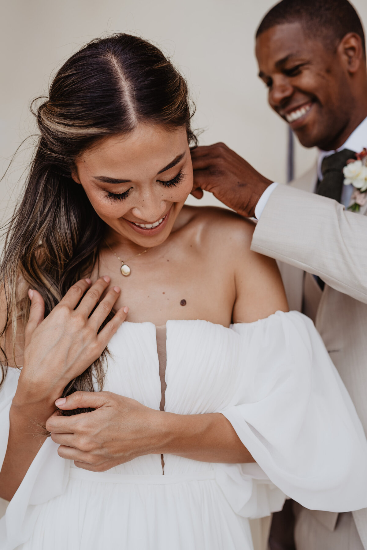 Utah Elopement Photographer captures groom putting necklace on bride