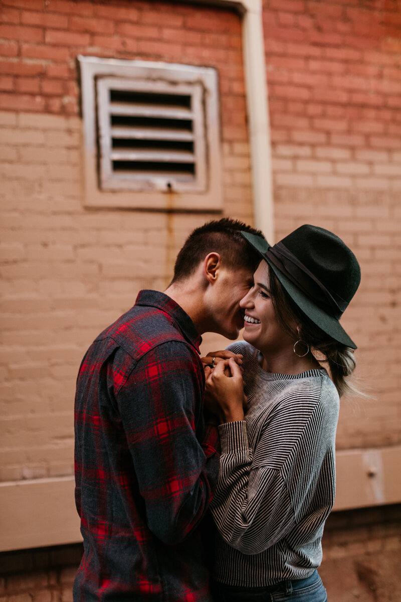 man kissing wife downtown Albuquerque