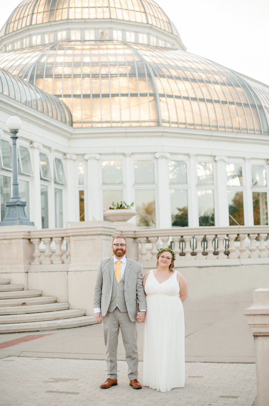 wedding couple stands outside como zoo conservatory in st paul minnesota elopement