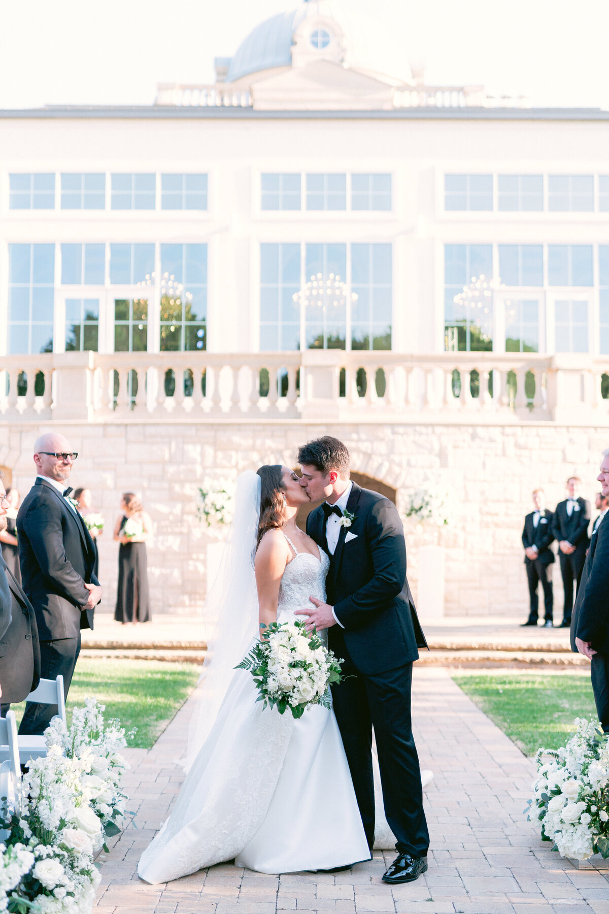 Bride and groom kissing at Luxury wedding at The Olana, Dallas