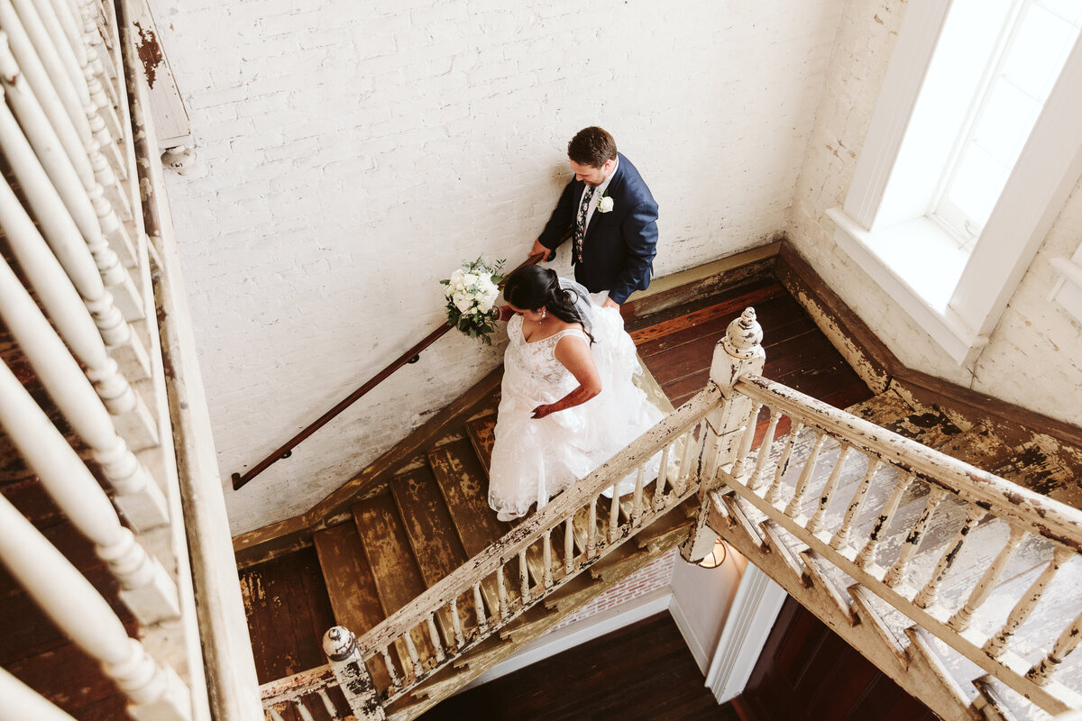 couple walking down staircase in new orleans