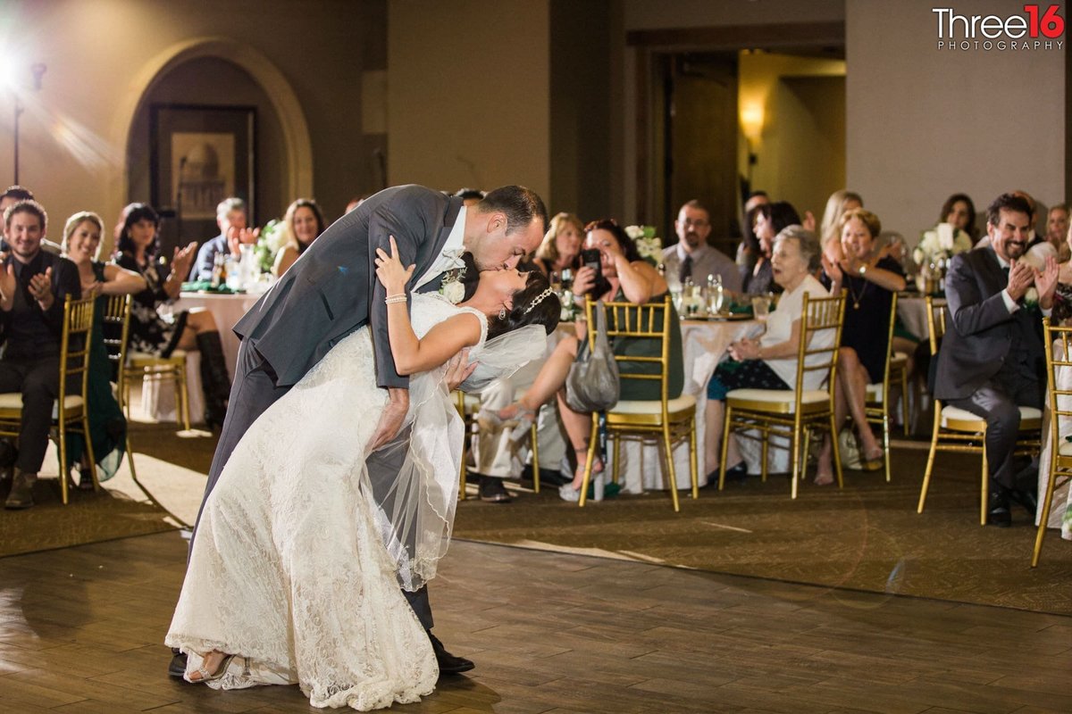 A dip and a kiss from the Groom to his Bride on the dance floor