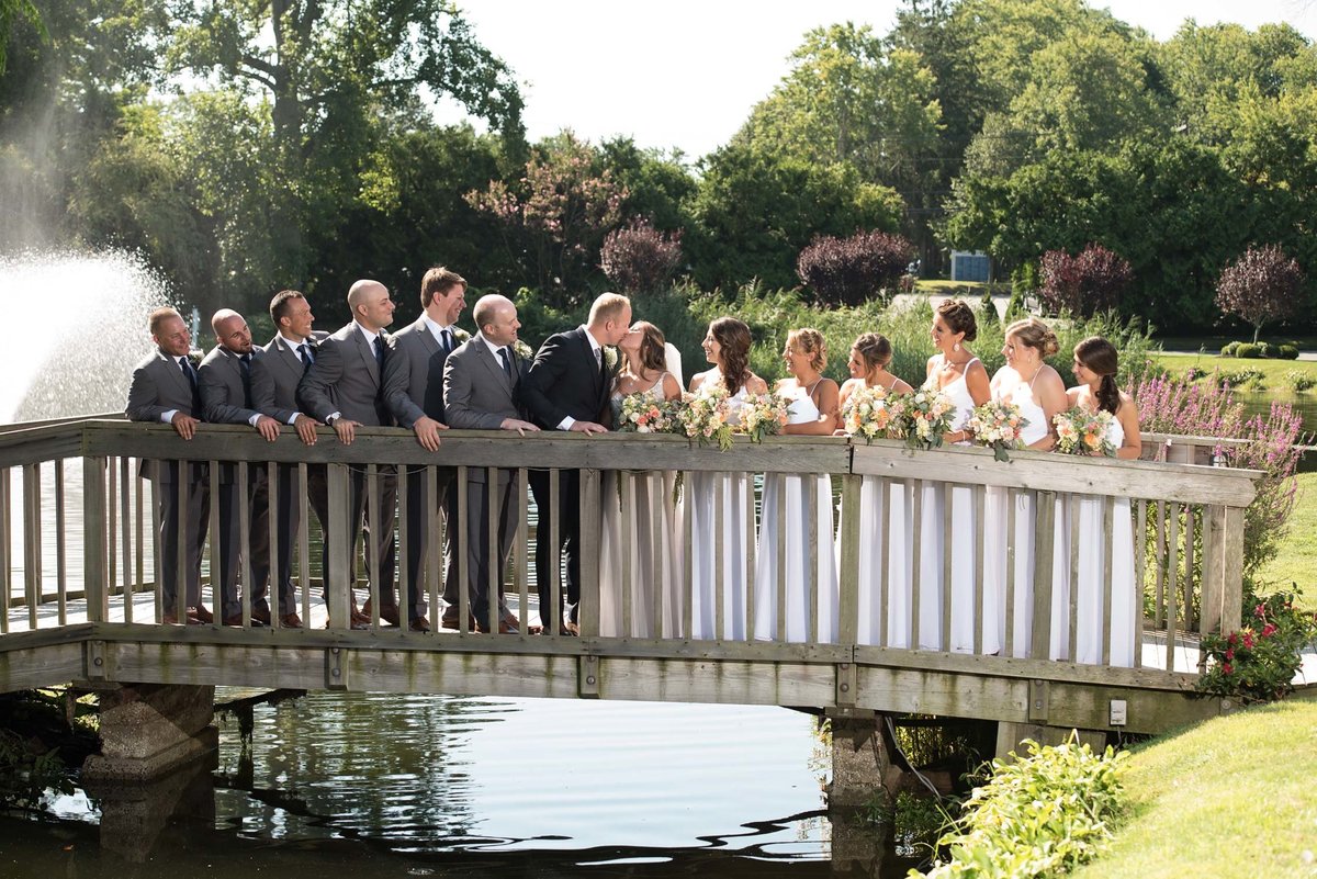 Bridal party on the bridge outside at Flowerfield