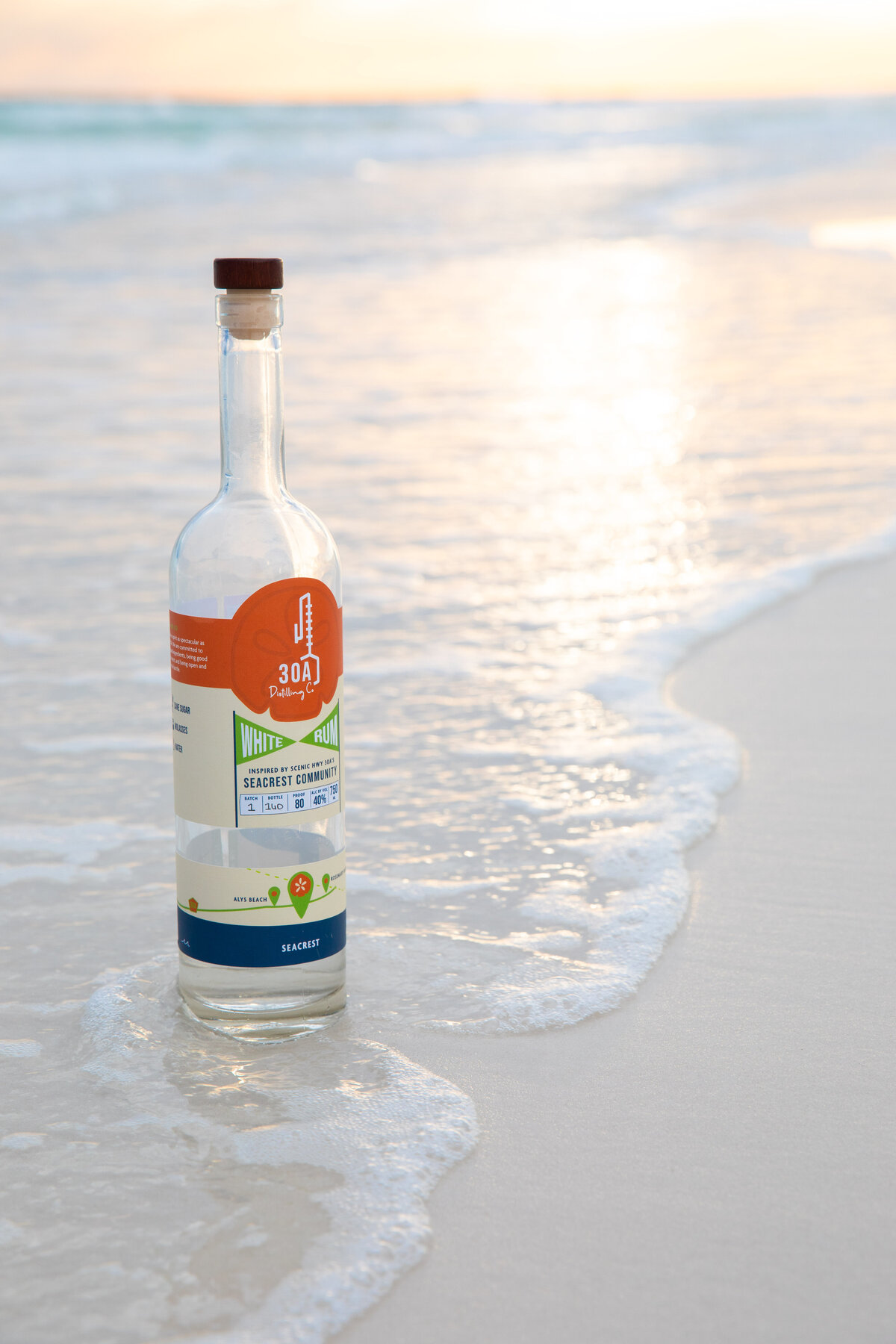 image of 30A Distillery vodka bottle taken at the beach on 30-A Florida by Kassady Gibson Focus Creative photographer