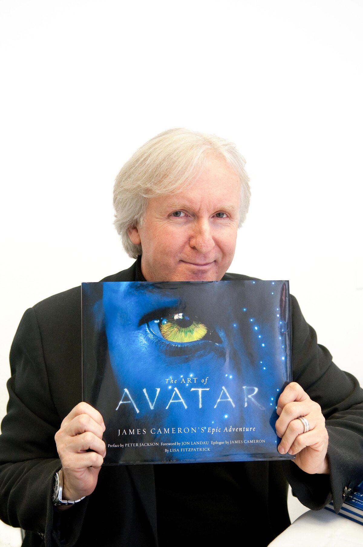 James Cameron  Poses for a portrait holding "The Art of Avatar" Book