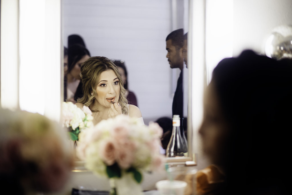 Wedding Photograph Of Woman Doing Her Lipstick Los Angeles