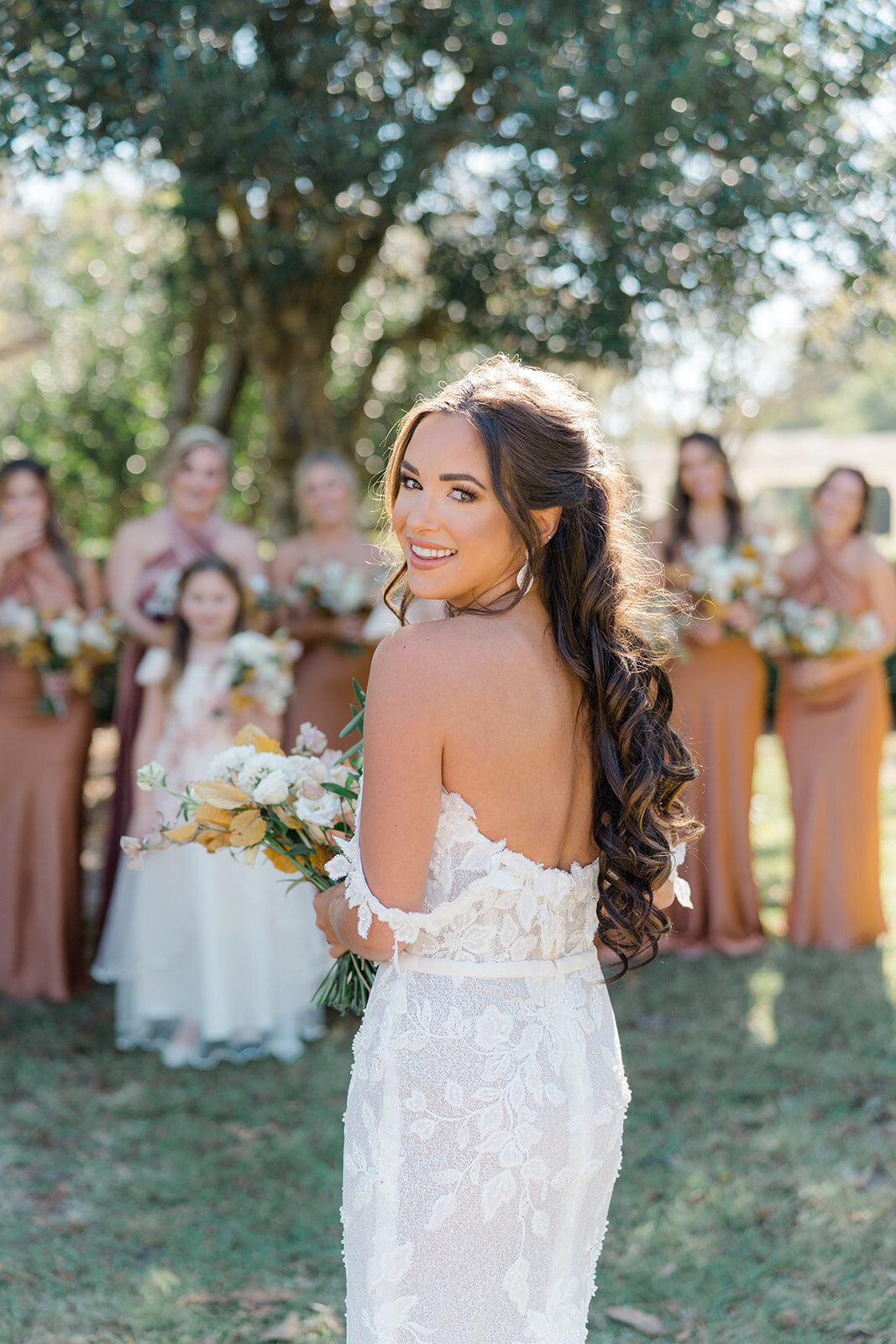 Bridesmaids see the bride in her dress for the first time during Boone Hall fall wedding. Destination wedding photographer. Off-shoulder wedding dress. Kailee DiMeglio Photography.