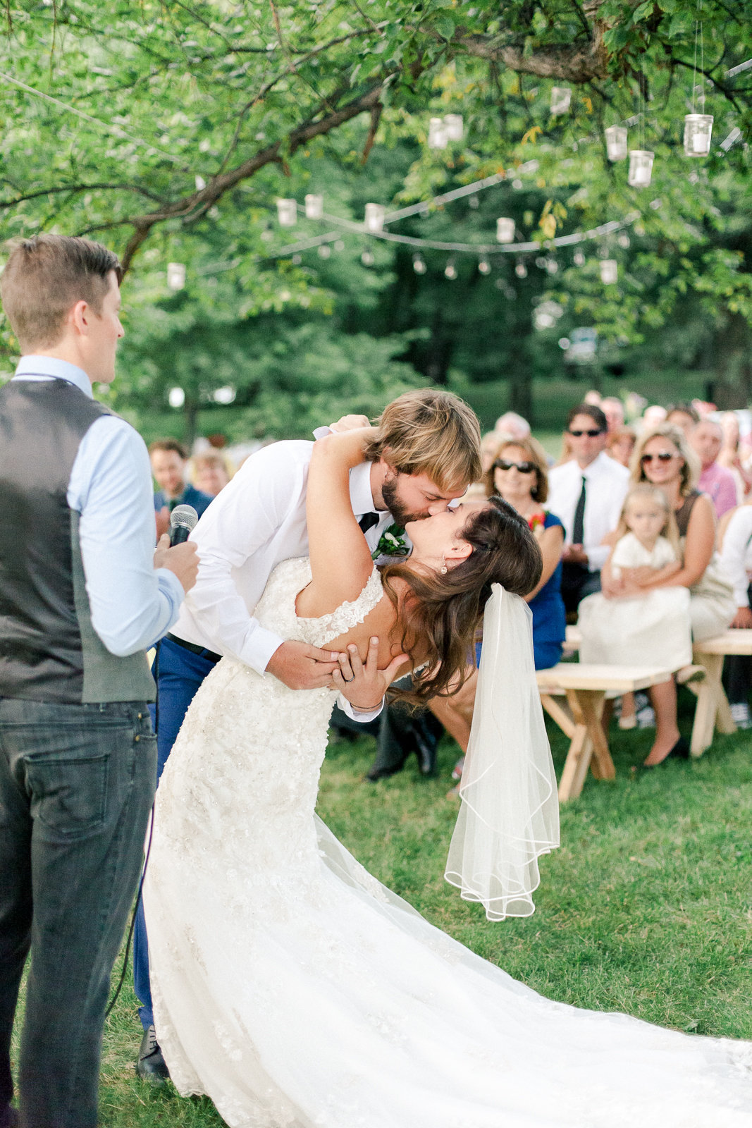 backyard wedding ceremony minnesota first kiss from bride and groom
