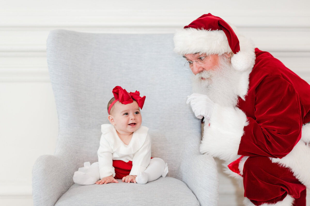 6 month old baby girl with Santa by Miami Christmas Mini Session Photographer