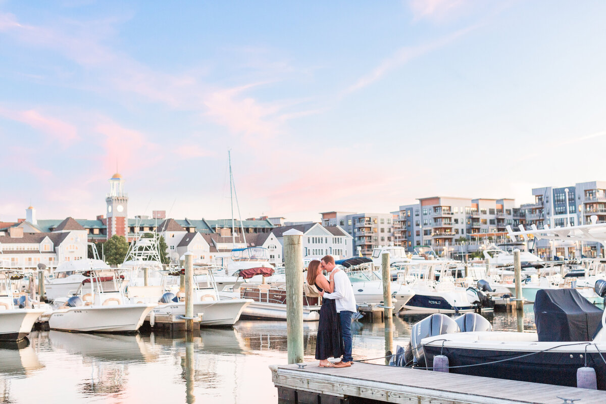 couple kissing in boatyard in Boston at sunset