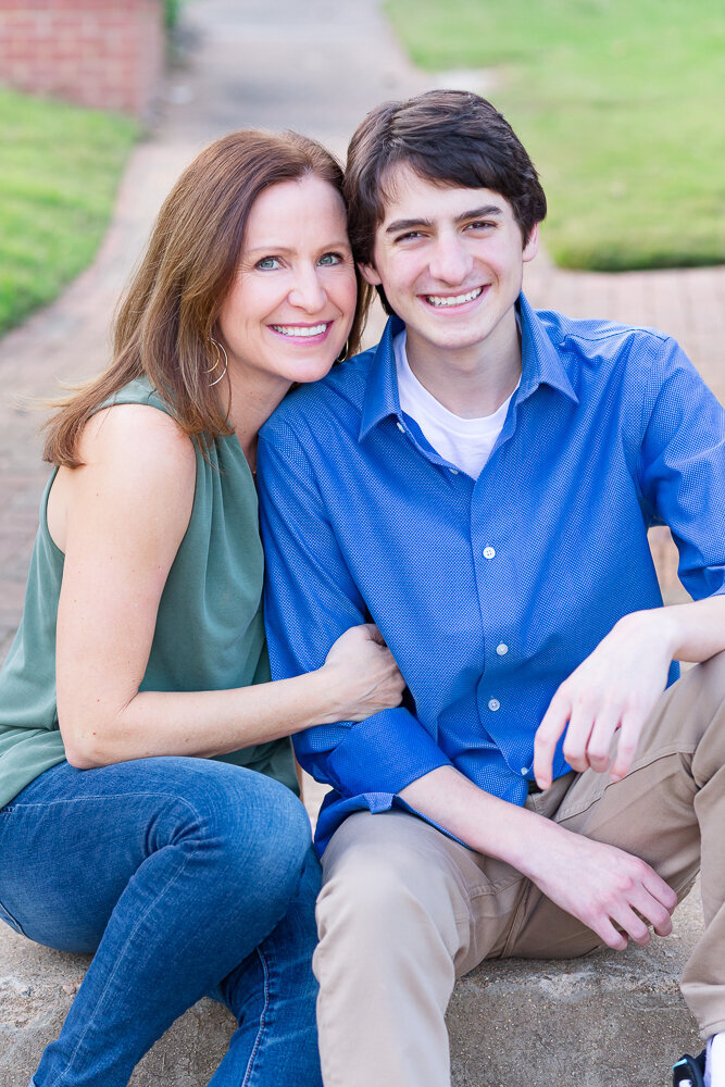 Sweet picture of mother and son sitting outdoors in Wake Forest, NC.