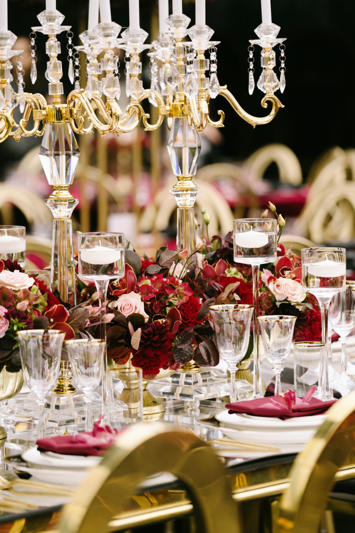 black-gold-burgundy-red-tent-reception-chandeliers-roses-candelabra-floating-candle
