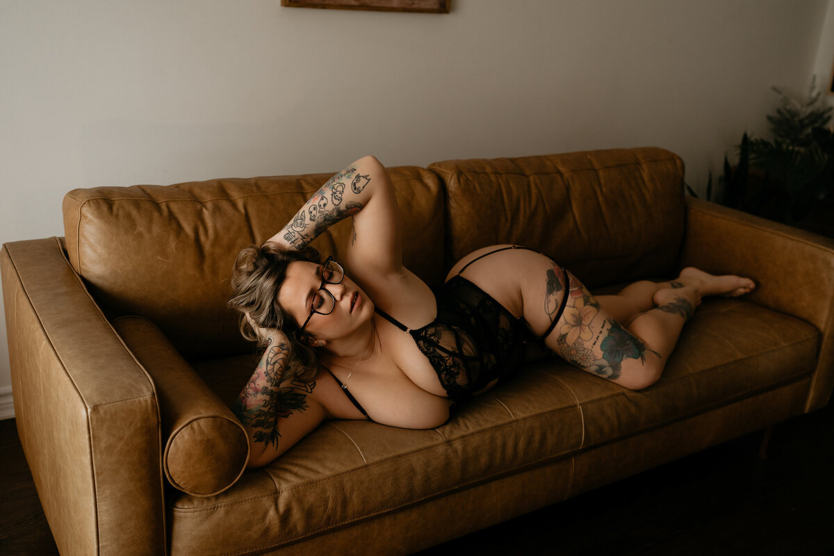 woman laying on a couch